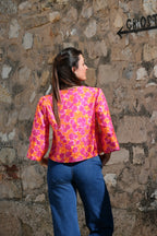 Top con fiocchetti